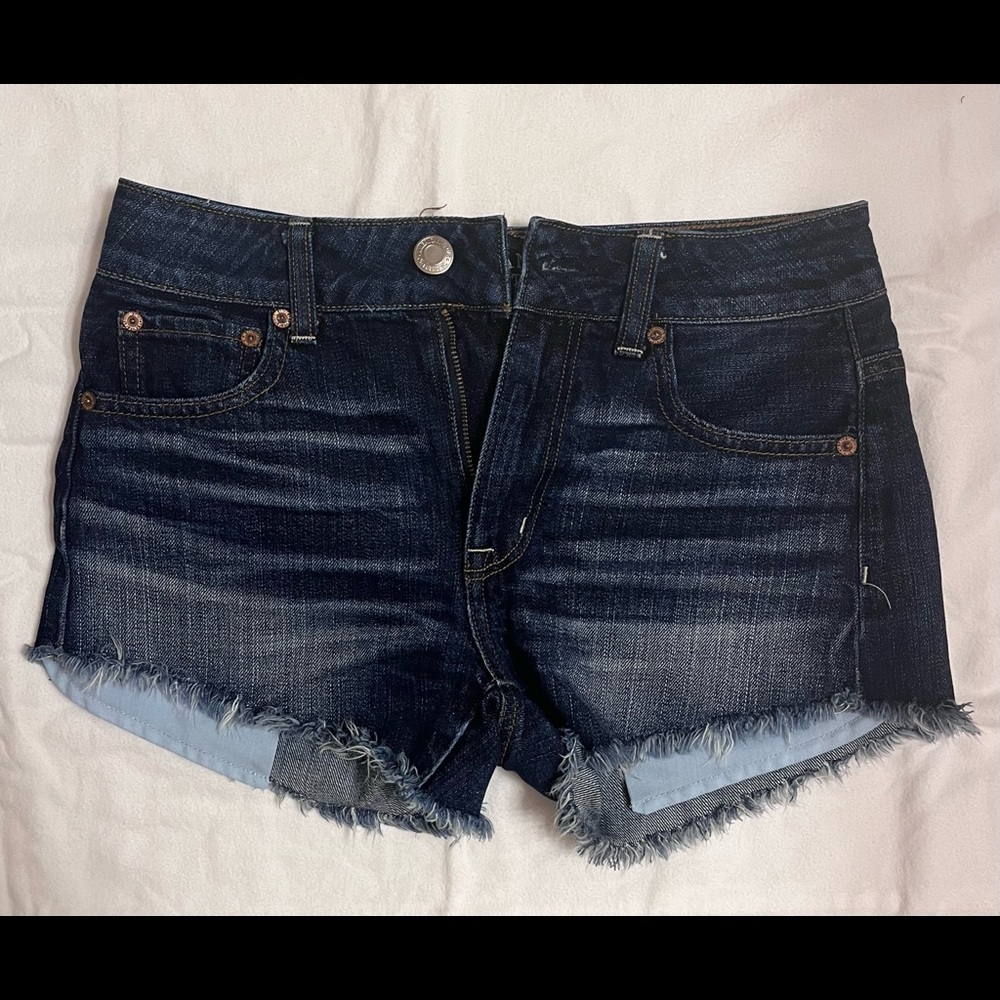 Women’s dark blue wash American Eagle denim shorts.
